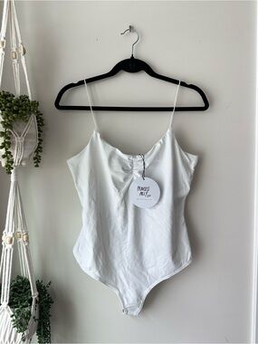 Princess Polly white bodysuit
Size 10
Brand new with tags
